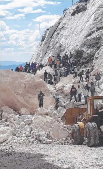  ?? Picture: AP ?? People walk over a collapsed section of a marble mine in Dengantzha, Mexico.