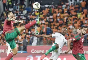  ?? — AFP ?? Morocco’s defender Manuel Da Costa (L) challenges Ivory Coast’s forward Salomon Kalou (C) next to Morocco’s defender Mehdi Benatia during the 2017 Africa Cup of Nations Group C match in Oyem.