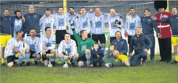  ??  ?? Holyhead Town celebrate winning the Gwynedd League and Gwynedd Cup double.