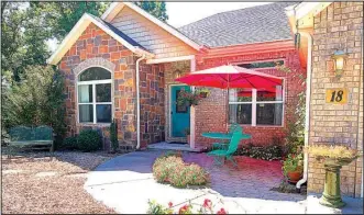  ??  ?? This three-bedroom home includes a huge family room with a wet bar. Joy Terrell, (479) 366-1947