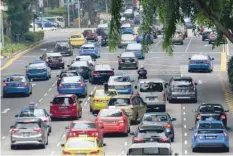  ?? — AFP ?? Motorists entering the central business district in Singapore.