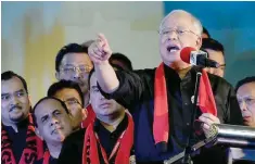  ?? — AFP ?? Malaysian Prime Minister Najib Razak gestures while addressing Rohingya refugees during a gathering in Kuala Lumpur.