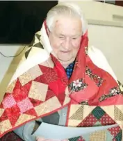  ??  ?? Vietnam Veteran Vic Donohoe looks thrilled with his Quilt of Valour, certificat­e and letter recognisin­g his war service. The organisati­on dreams to wrap all veterans in love for their sacrifice.