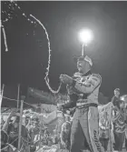  ?? DAVE KALLMANN / MILWAUKEE JOURNAL SENTINEL ?? Ty Majeski sprays champagne after winning the 41st Slinger Nationals last July at Slinger Speedway.