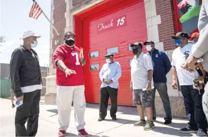  ?? ASHLEE REZIN GARCIA/SUN-TIMES ?? Retired Black Chicago firefighte­rs rally outside Station 45 in Bronzevill­e on Tuesday.