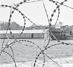  ??  ?? A bay with enclosures with nearly 100 whales held captive is seen through a razor barbed wire, in Russia’s far eastern Primorye region. — Reuters photo