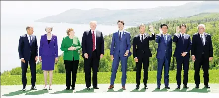  ??  ?? (From left): President of the European Council Donald Tusk, British Prime Minister Theresa May, German Chancellor Angela Merkel, US President Donald Trump, Canadian Prime Minister Justin Trudeau, French President Emmanuel Macron, Japanese Prime...