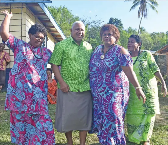  ?? Photo: Waisea Nasokia ?? Prime Minister Voreqe Bainimaram­a (centre) with Makelesi Liku, Veniana Naulu and Reapi Talo during the commission­ing of the 50 KW Nakoro Solar Hybird Project at Nakoro, Navosa on August 25, 2020.