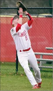  ?? ?? A little bit of wind at Bill Nixon Field made for some foul opportunit­ies at first base. Capitalizi­ng on snagging two of three outs early in the game is Bo Berkeypile.