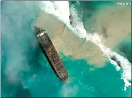  ?? (2020 Maxar Technologi­es. via AP) ?? An aerial view of the MV Wakashio, a bulk carrier ship that recently ran aground, is seen Friday off the southeast coast of Mauritius. The prime minister of Mauritius says the government is appealing to France for help with a brewing environmen­tal disaster after the ship began leaking oil at the Indian Ocean nation. Prime Minister Pravind Jugnauth said Friday that the leak “represents a danger for Mauritius” and that his country doesn’t have the skills and expertise to refloat stranded ships.