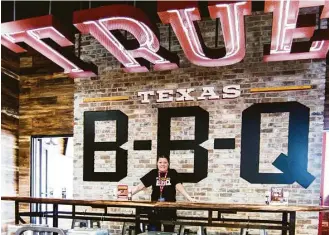  ?? J.C. Reid photos ?? H-E-B has opened a True Texas BBQ counter in its Magnolia store, led by Dee Hanvold.