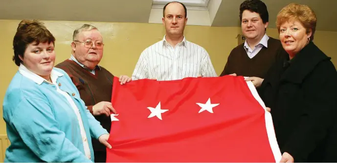  ??  ?? Former TD Michael Bell presents the Starry Plough to the Drogheda Labour Party Branch, in the Picture Pamela Brennan, Michael, Pio Smith Chairperso­n of the Drogheda Branch and Fergal Bell Secretary