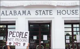  ?? (AP/The Montgomery Advertiser/Jake Crandall) ?? People protest the prison plan Wednesday at the Alabama State House in Montgomery.