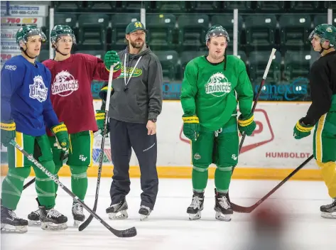  ??  ?? The Humboldt Broncos returned to the ice five months after a bus crash that killed 16 and injured 13 others. Returning players Brayden Camrud, left, and Derek Patter, fourth from left, suited up for practice at Elgar Petersen Arena on Sept. 11, 2018.