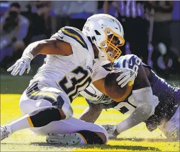  ?? Robert Gauthier Los Angeles Times ?? CHARGERS running back Austin Ekeler (30) is from Eaton, Colo., and played in college at Western Colorado.