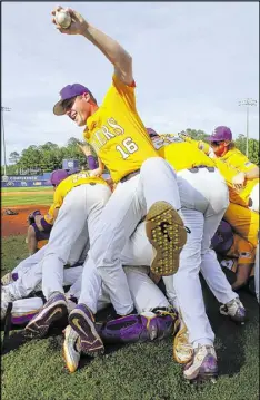  ?? AP ?? LSU players celebrate after defeating Arkansas in the SEC championsh­ip game Sunday in Hoover, Ala. The Tigers earned the No. 4 seed in the NCAA tournament behind Oregon State, North Carolina and Florida.