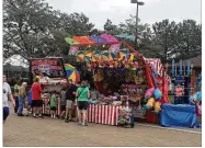  ?? TODD JACKSON / STAFF ?? People returned to the Ohio State Fair on Thursday, a day after an amusement park ride broke apart, killing an 18-year-old Columbus man and injuring several others.