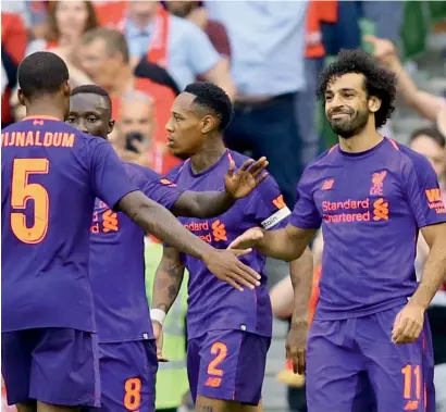  ?? AFP ?? liverpool’s Mohamed Salah (right) celebrates scoring the team’s third goal against napoli in a pre-season friendly. —