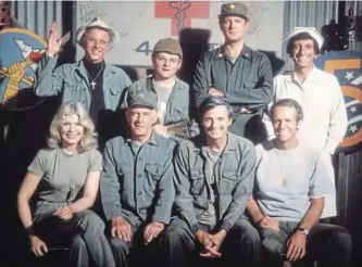  ?? CBS ?? The cast from the final season of M*A*S*H, a comedy about the horror of war.