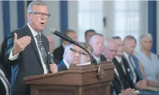  ?? MICHAEL BELL ?? Premier Brad Wall shuffled his cabinet Wednesday to replace five members who resigned to run for his job.