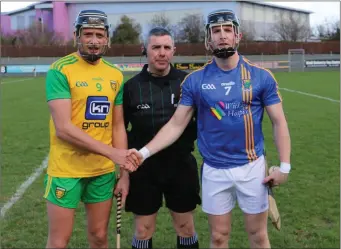  ??  ?? Donegal’s Danny Cullen and Wicklow’s Warren Kavanagh shake hands before throw in.