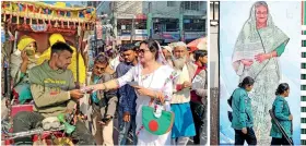  ?? ?? Anwara Islam Rani gives a leaflet to a rickshaw puller during a campaign event in Rangpur. (Photo by Ador RAHMAN / AFP)
Policewome­n walk past a poster of PM Sheikh Hasina.