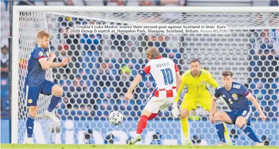  ?? Picture REUTERS ?? Croatia’s Luka Modric scores their second goal against Scotland in their Euro 2020 Group D match at Hampden Park, Glasgow, Scotland, Britain.