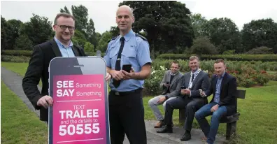  ??  ?? Ken Tobin (Tralee Chamber Alliance) with Garda Sgt Tim O’Keeffe and (seated) David Scott (Tralee Chamber Alliance), Mayor of Tralee Graham Spring and Brian Stephenson at the launch of the new ‘See Something Say Something’ text alert service.