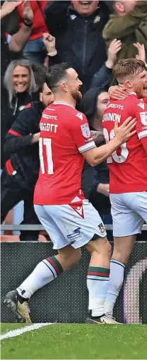  ?? Ben Roberts Photo ?? ●●Former County man Andy Cannon of Wrexham celebrates scoring his team’s second goal with teammates