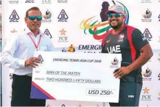  ?? Courtesy: ACC ?? UAE opener Ashfaq Ahmad receives the Man of the Match award in the Emerging Teams Asia Cup tournament in Karachi.