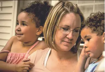  ??  ?? Zoey Mendoza Zimmerman with her two children, Jada, left, and Jordan, before the children were shot to death by their father in 2010. He then turned the gun on himself.