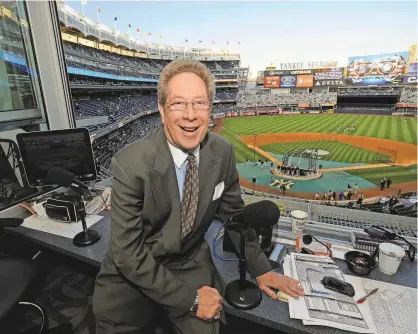  ?? BILL KOSTROUN/AP ?? Broadcaste­r John Sterling, shown before a recent game, has been in the Yankees booth since 1989.