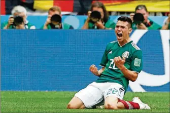  ?? ANTONIO CALANNI/THE ASSOCIATED PRESS ?? Mexico’s Hirving Lozano, celebrates scoring his side’s opening goal during the group F match between Germany and Mexico, Sunday in the Luzhniki Stadium in Moscow, Russia.