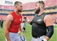  ?? Ed Zurga/Associated Press ?? Kansas City Chiefs tight end Travis Kelce, left, talks to his brother, Philadelph­ia Eagles center Jason Kelce, after they exchanged jerseys following a 2017 game in Kansas City. For the first time in Super Bowl history, a pair of siblings will play each other on the NFL’s grandest stage.