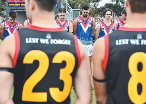  ?? Picture: JAY TOWN ?? LEST WE FORGET: South Barwon and St Joseph’s players reflect before the first bounce on Tuesday.