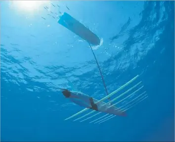  ?? Photograph­s by Boeing ?? THE SENSOR HOSTING Autonomous Remote Craft, or SHARC, combines a surfboard-shaped drone platform with Boeing’s sensor technology. The drone is powered by waves and solar energy.