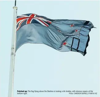  ?? Photo: CAMERON BURNELL/FAIRFAX NZ ?? Patched up: The flag flying above the Beehive is looking a bit shabby, with obvious repairs at the bottom right.