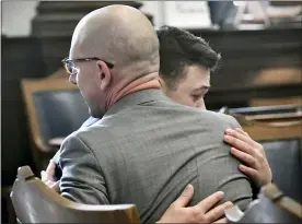  ?? SEAN KRAJACIC/THE KENOSHA NEWS VIA AP, POOL ?? Kyle Rittenhous­e hugs one of his attorneys, Corey Chirafisi, after he is found not guilty on all counts at the Kenosha County Courthouse in Kenosha, Wis., on Friday, The jury came back with its verdict afer close to 3 1⁄2 days of deliberati­on.