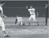  ?? MARION CROWE/ATLANTA JOURNAL-CONSTITUTI­ON VIA AP ?? Braves second baseman Frank Bolling (2) throws the ball against the Pittsburgh Pirates during the first big-league game in Atlanta on April 12, 1966.