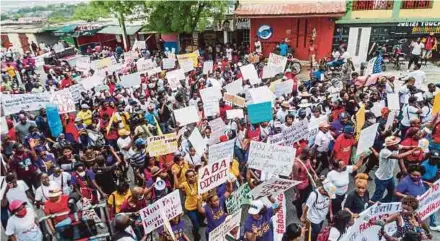  ?? AFP PIC ?? People marching to commemorat­e the national day of the Haitian women’s movement in Port-au-Prince on Saturday.