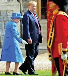  ??  ?? This way: They inspect the Coldstream Guards at Windsor