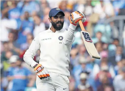  ?? AFP ?? India’s Ravindra Jadeja celebrates after reaching his fifty on the third day of the fifth Test against England at The Oval on Sunday. —