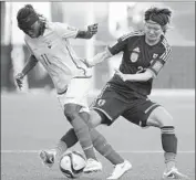  ?? Kevin C. Cox
Getty Images ?? JAPAN’S Kana Kitahara, left, of Japan challenges Monica Quinteros of Ecuador in Group C match.