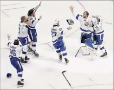  ?? Bruce Bennett / Getty Images ?? The Tampa Bay Lightning celebrate following the series-winning 2-0 victory over Dallas on Monday.