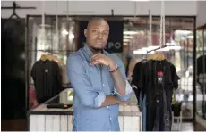  ?? ?? Tshepo Mohlala, founder of Tshepo Jeans, poses for a photograph at his workshop in Johannesbu­rg.