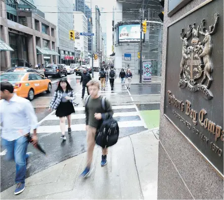  ?? PETER J. THOMPSON ?? Hudson’s Bay Co. missed analyst estimates with a net loss of $201 million, or $1.10 per share, though digital sales rose 12.7 per cent in the second quarter. The retailer is streamlini­ng operations and increasing efficienci­es to save about $170 million...