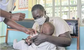  ?? ?? HELP ON THE WAY: A child gets a malaria vaccinatio­n at Yala Sub-County hospital in Yala, Kenya.