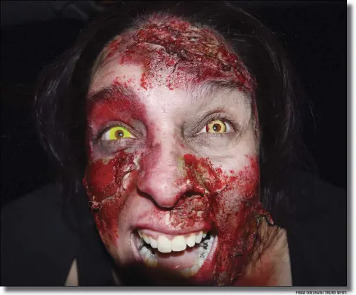  ?? FRAM DINSHAW/ TRURO NEWS ?? Meet Angela Bailey, a zombie that popped out straight in front of the lens with her blood-spattered face at the Blood elds Maze on RiverBreez­e Farm, near Truro.