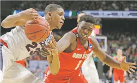  ?? TED S. WARREN/THE ASSOCIATED PRESS ?? Gonzaga guard Zach Norvell Jr., left, pushes the ball on Ohio State forward Jae’Sean Tate on Saturday in the NCAA Tournament in Boise, Idaho.