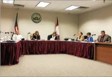  ?? NICHOLAS BUONANNO — NBUONANNO@TROYRECORD.COM ?? Members of the Troy City Council voted 5-4to approve Mayor Patrick Madden’s proposed 2018budget, which includes a $160trash fee, during a special meeting Friday night.